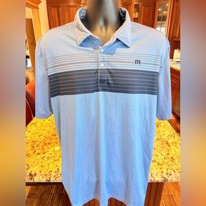 Travis Mathew men’s golf polo. Sharp blue & grey striped with logo.